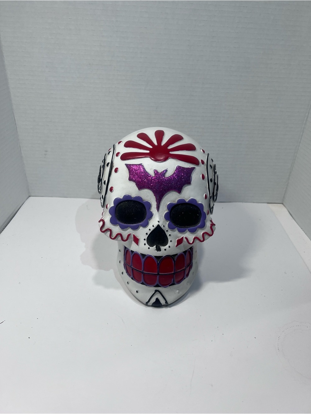Unlisted White Sugar Skull Sculpture with Purple and Red Accents